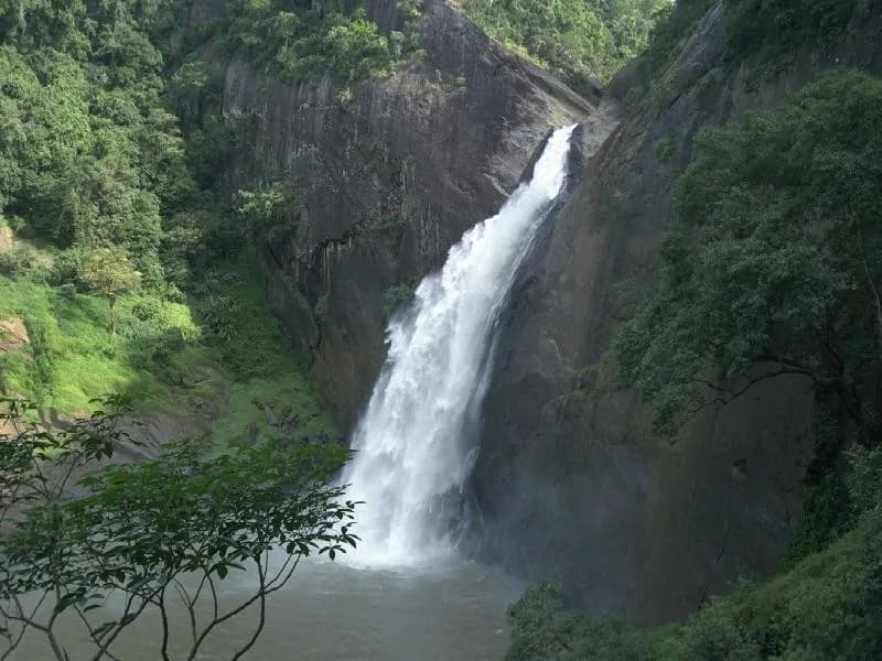 Roaring Dunhinda Falls spraying clouds of smoky mist in Badulla Sri Lanka