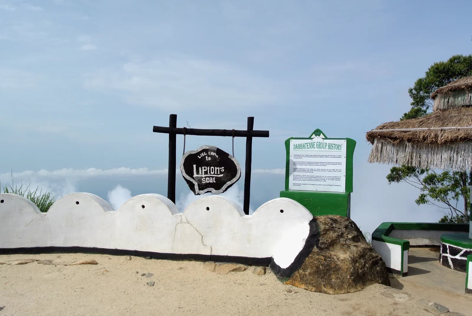Panoramic sunrise over rolling green tea hills and distant southern plains from Lipton's Seat in Haputale Sri Lanka