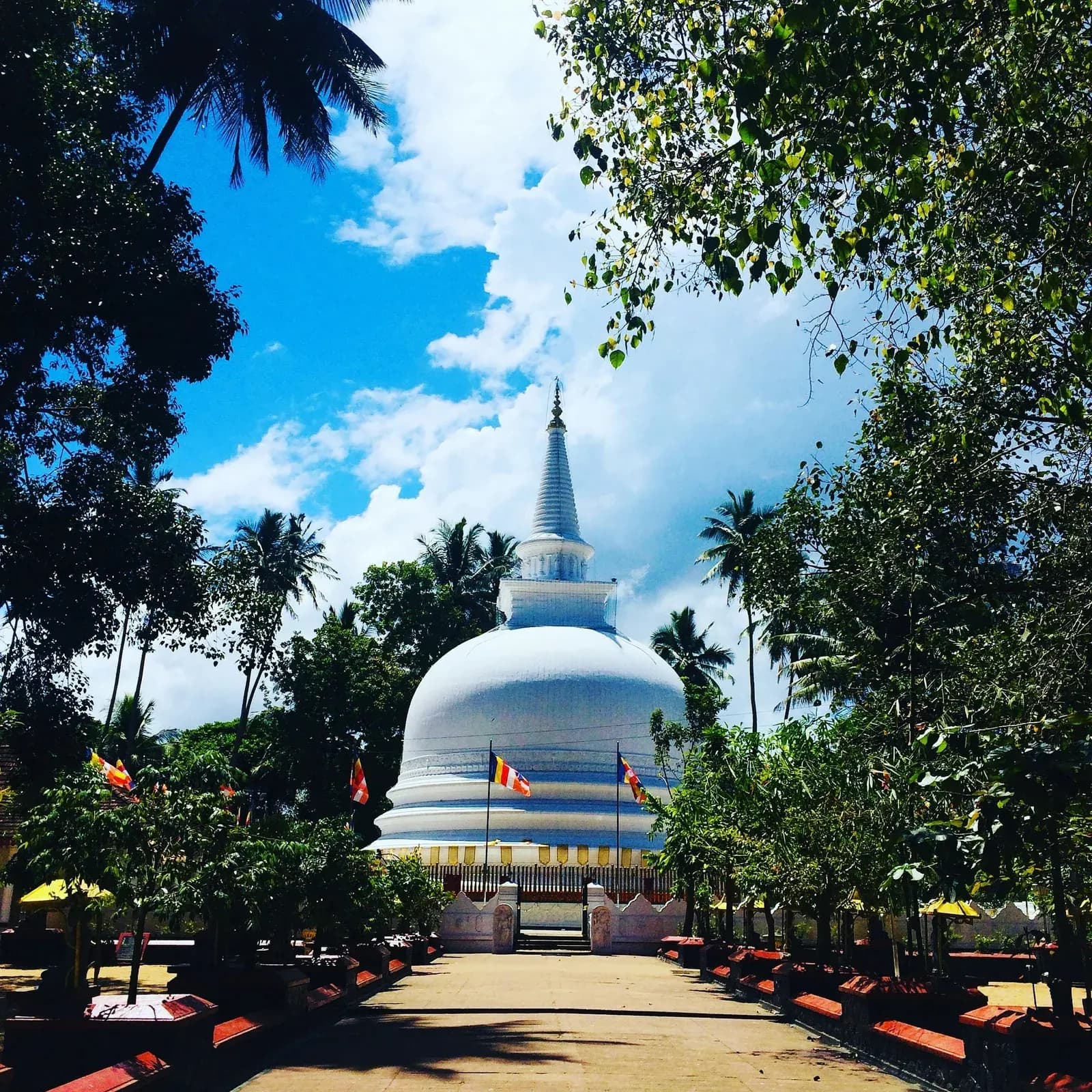 Intricate temple architectural carvings and sacred statues in ancient Sri Lanka.