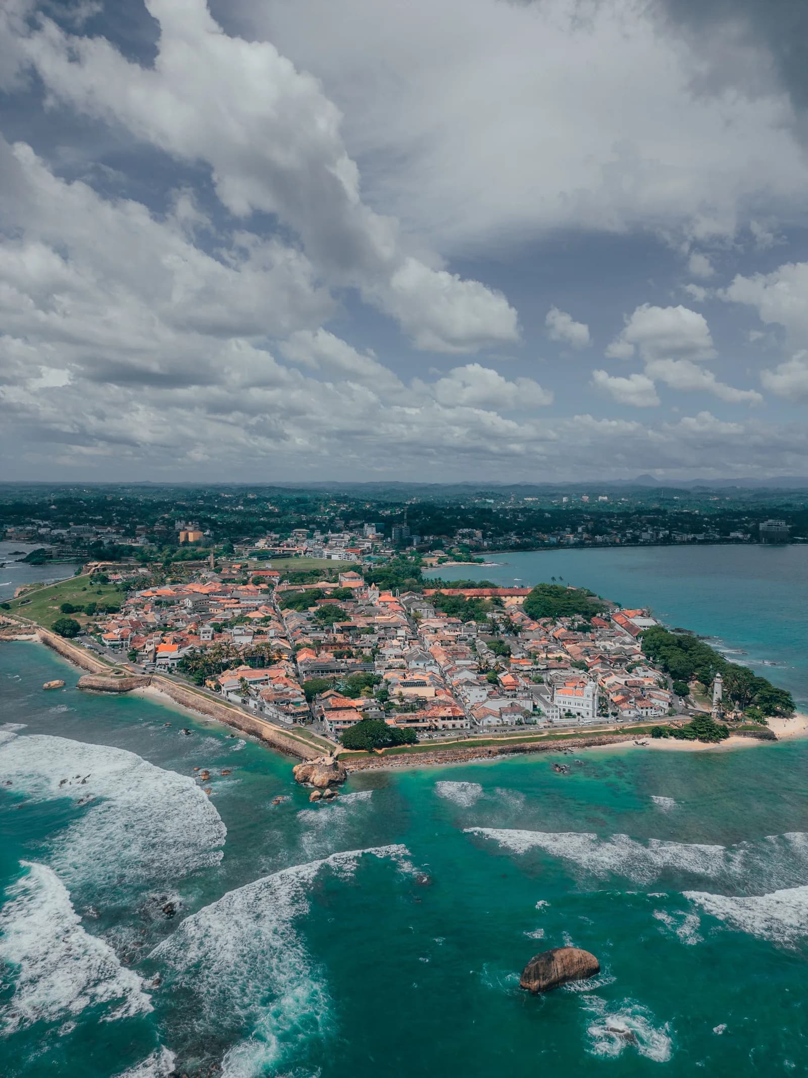 Vibrant tropical blue sea meeting the warm sandy coast of southern Sri Lanka.